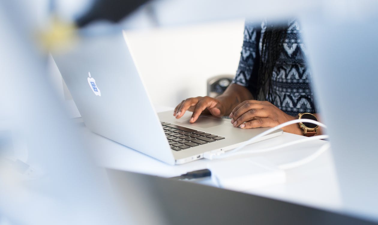 A professional working alongside AI tools at a desk, representing the changing nature of work in 2026